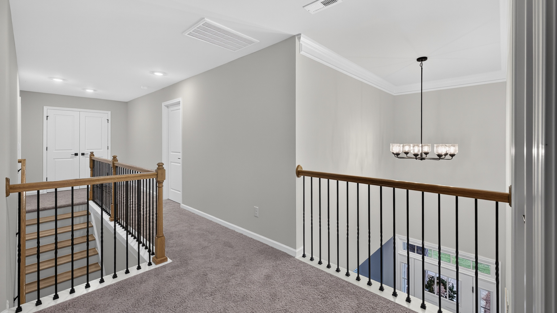 Upstairs landing area with view of stairs