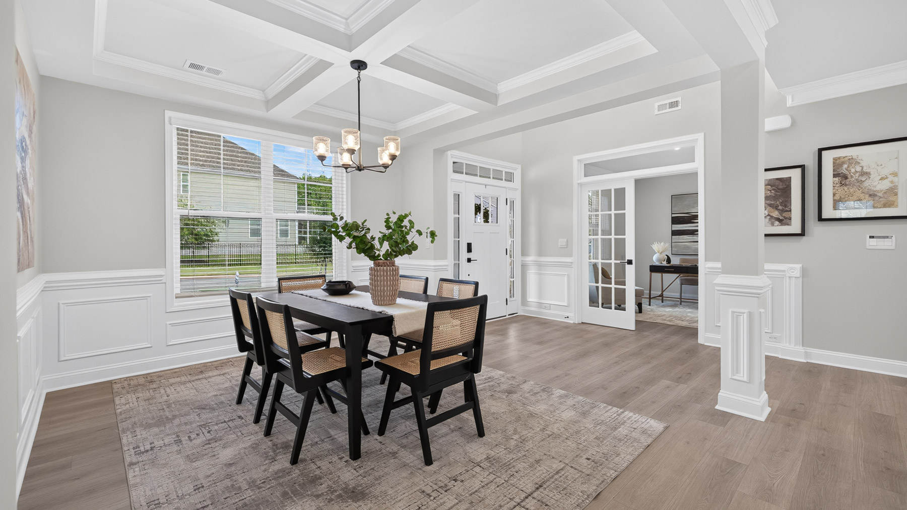 Dining room area with large windows and hanging light