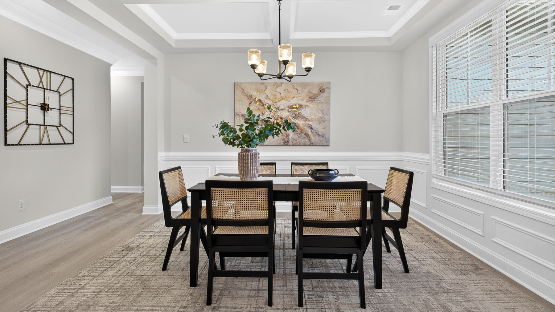 Dining room area with large windows and hanging light