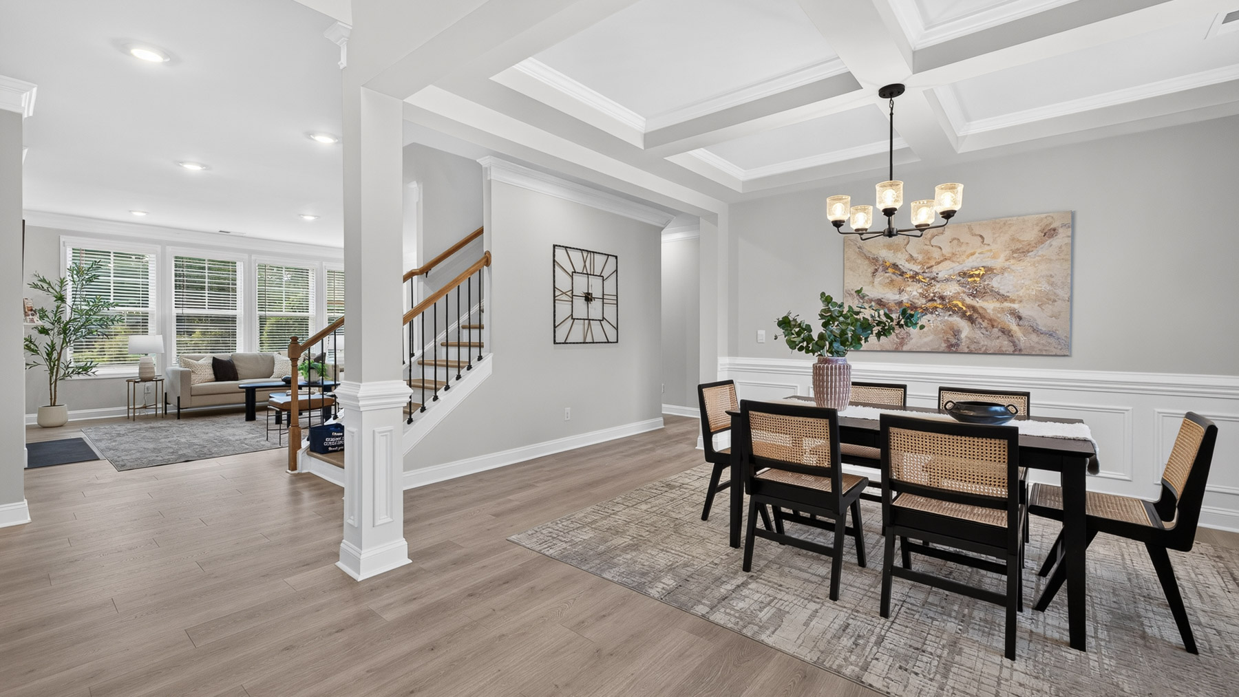 Dining room area with large windows and hanging light