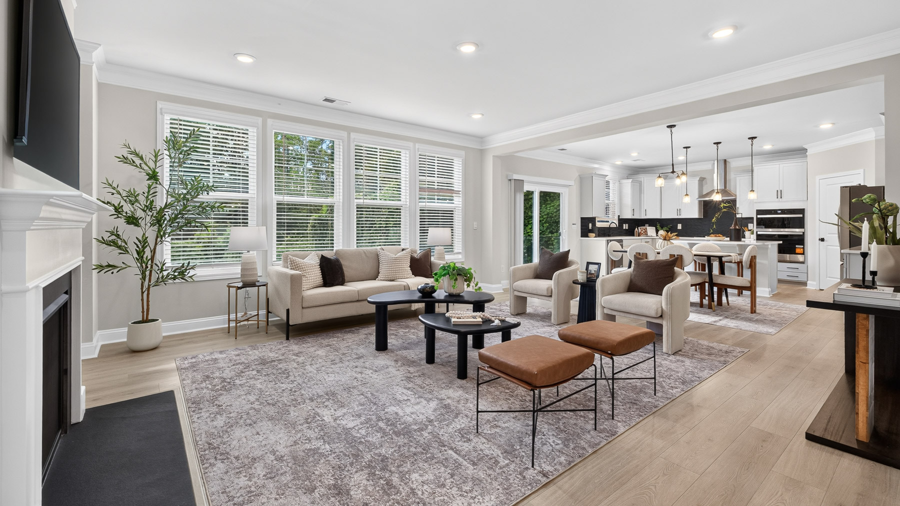 Open concept Living room with large windows and fireplace