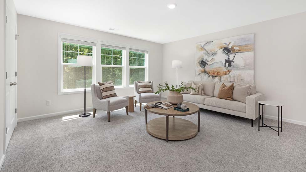Carpeted bedroom with windows