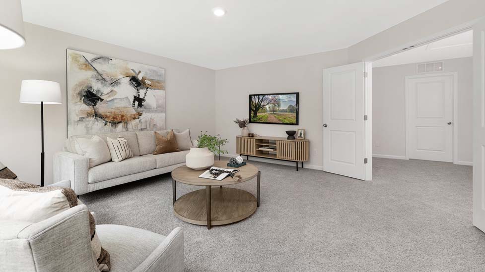 Carpeted bedroom with windows