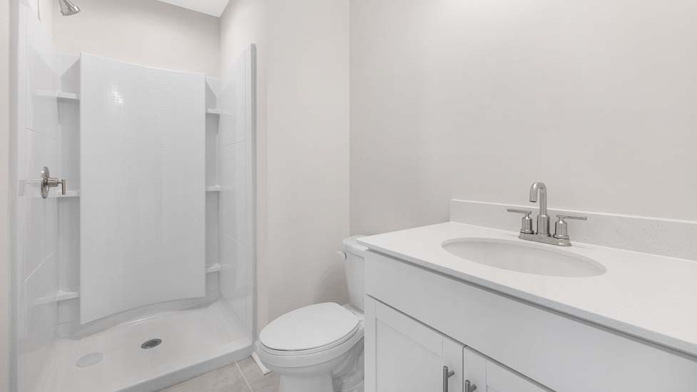bathroom with standing glass shower