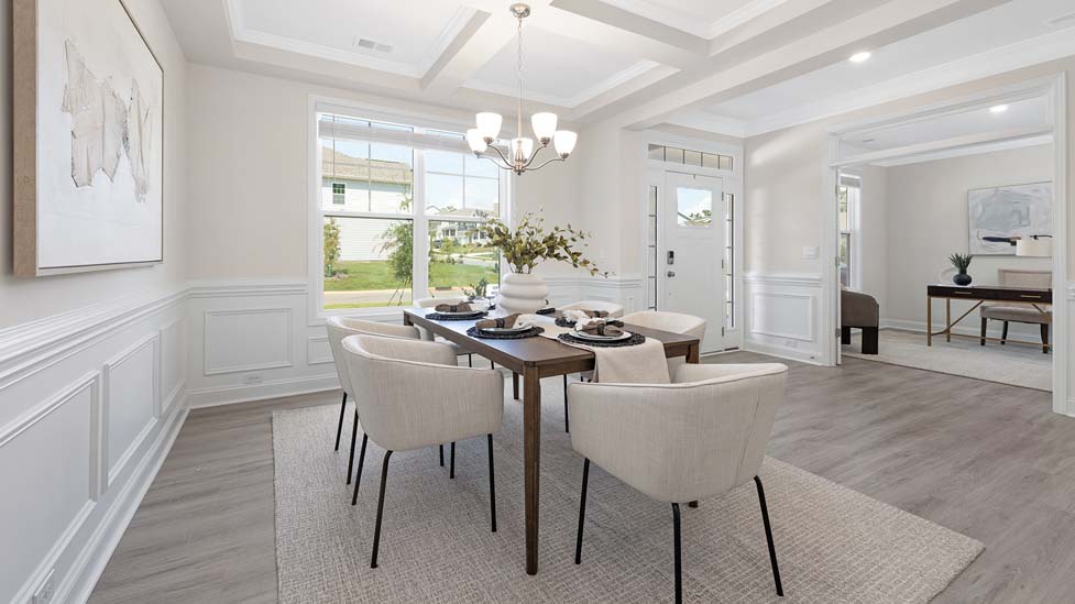 Dining room area with large windows and hanging light