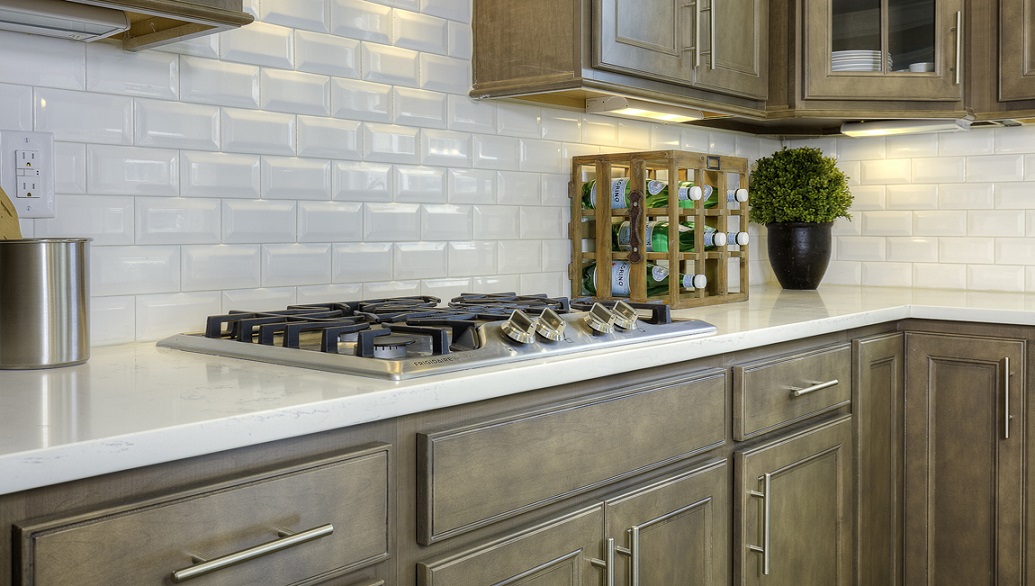 Kitchen with brown cabinets and gas stove