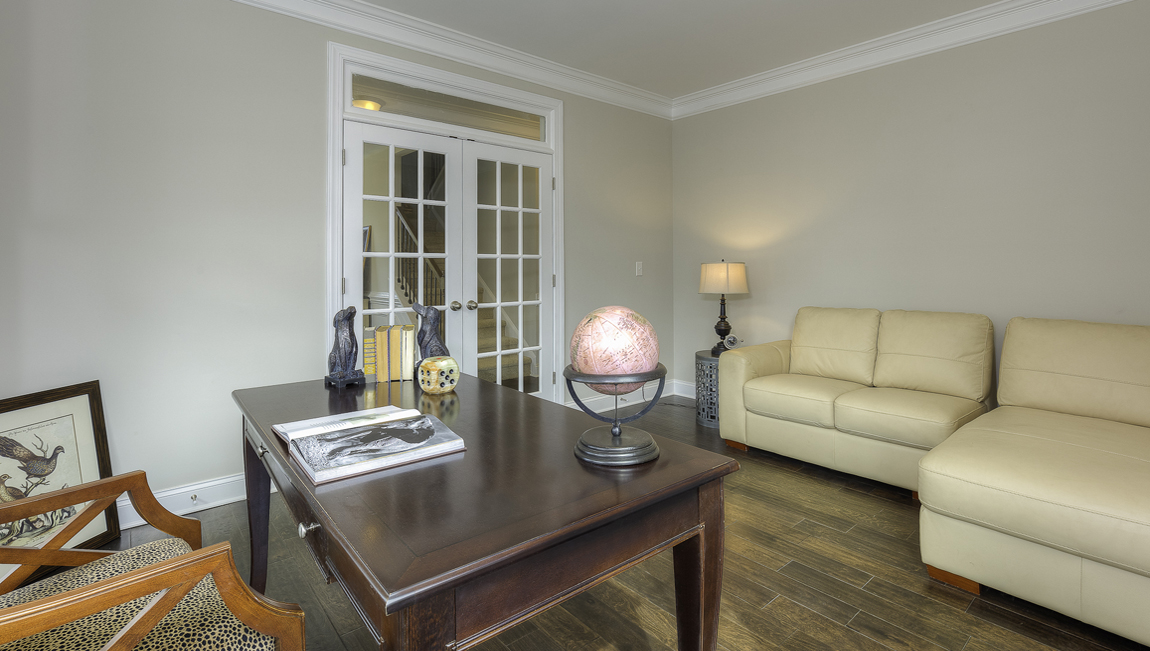 Flex room with wood floors,  two large windows and french doors