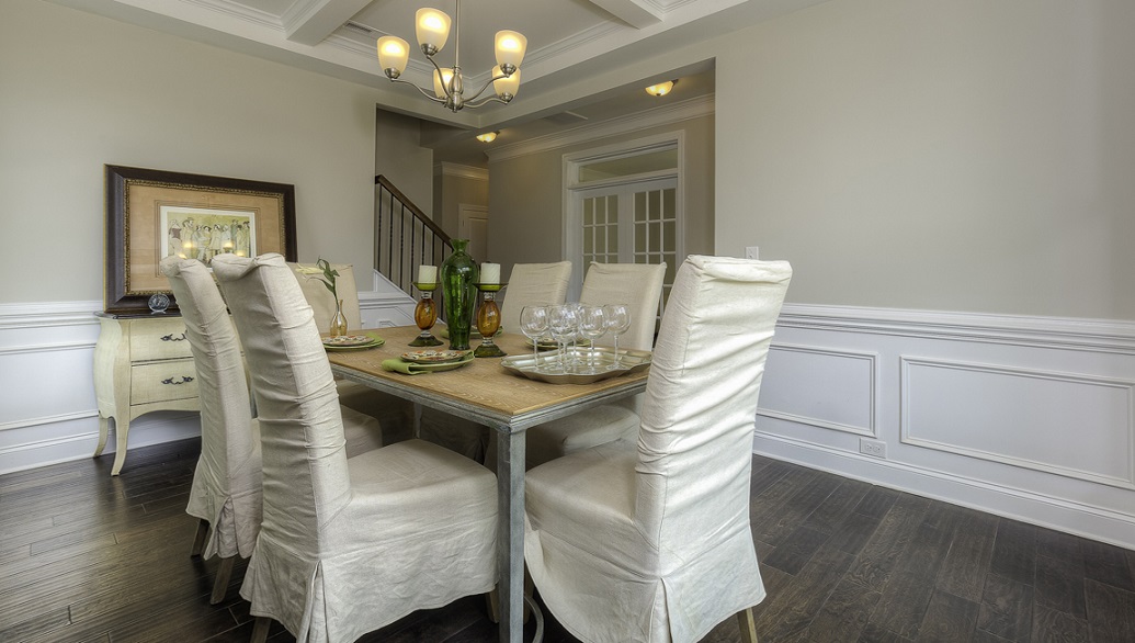 Dining room with wood floors and two large windows