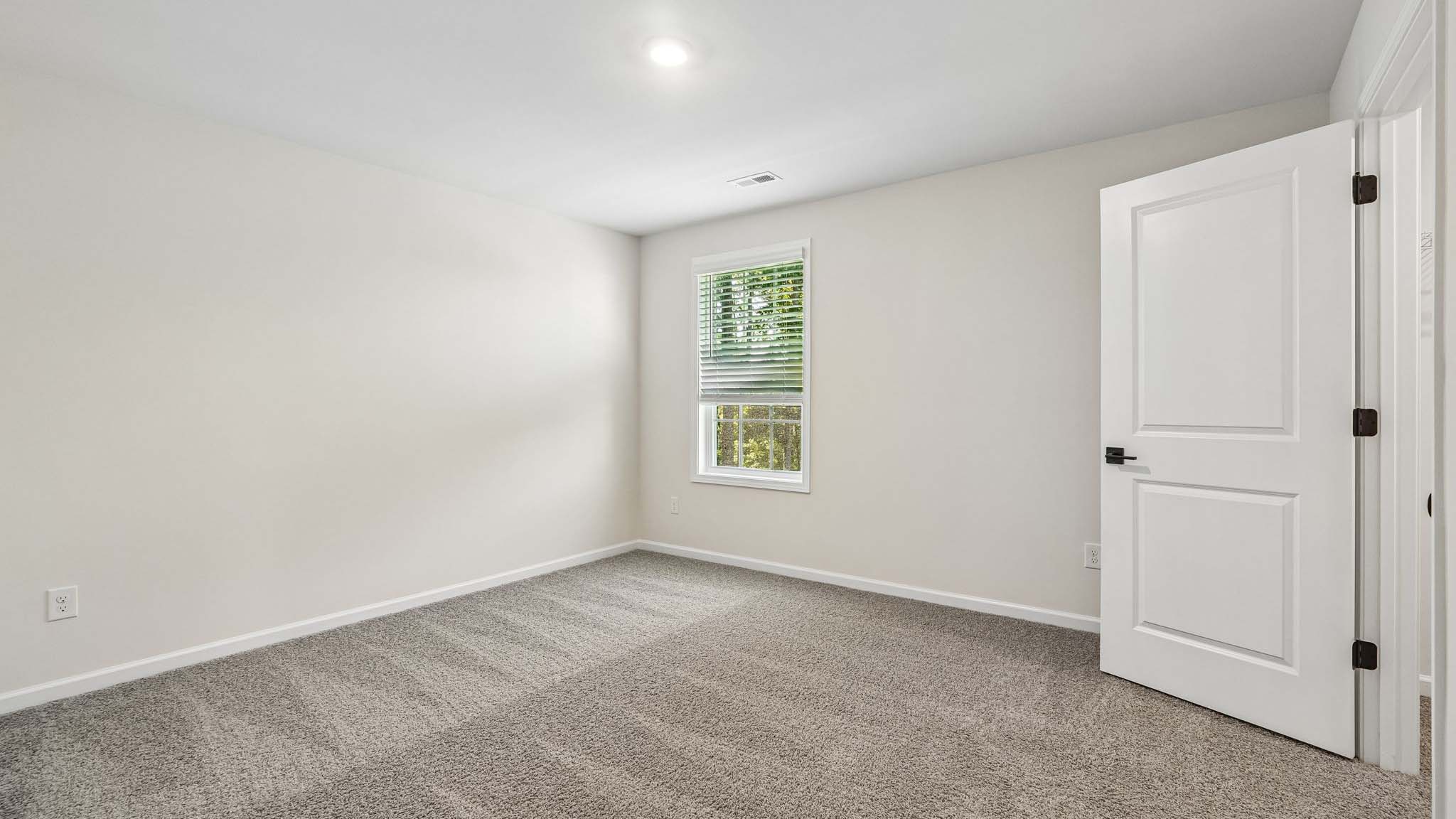 Carpeted bedroom