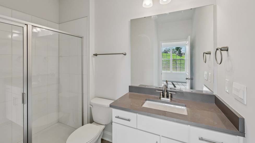 Bathroom with standing glass door shower