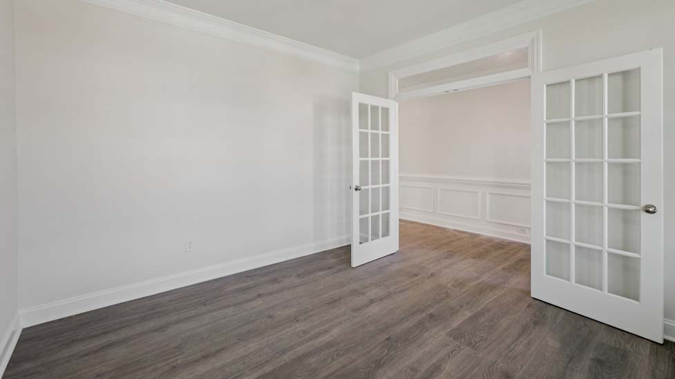 Flex room with french doors, and two large windows