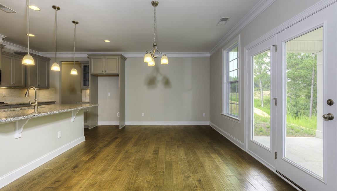Breakfast area beside kitchen with small window and back door