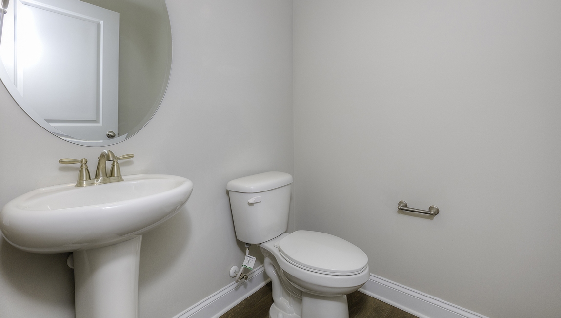 Powder bathroom with sink and toilet