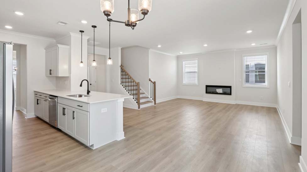 Kitchen and island with stainless steel appliances