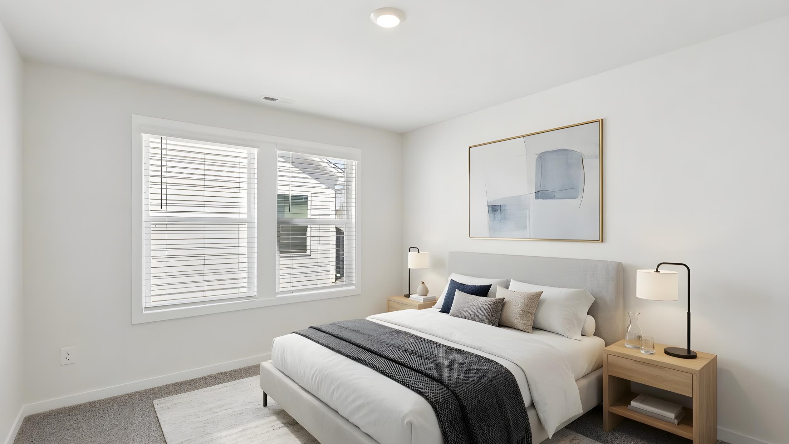 Carpeted bedroom with large window