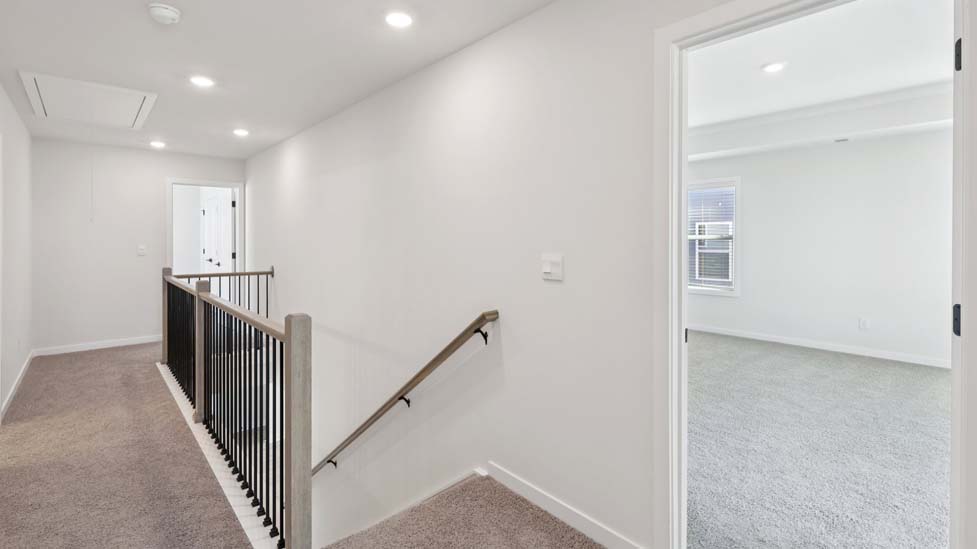 Upstairs landing and hallway with carpet