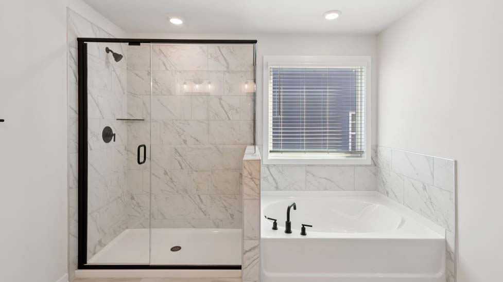 Primary bathroom with standing shower and double sinks
