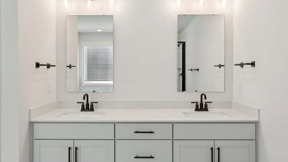 Primary bathroom with standing shower and double sinks