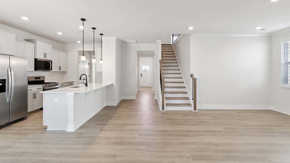 Kitchen and island with white cabinets