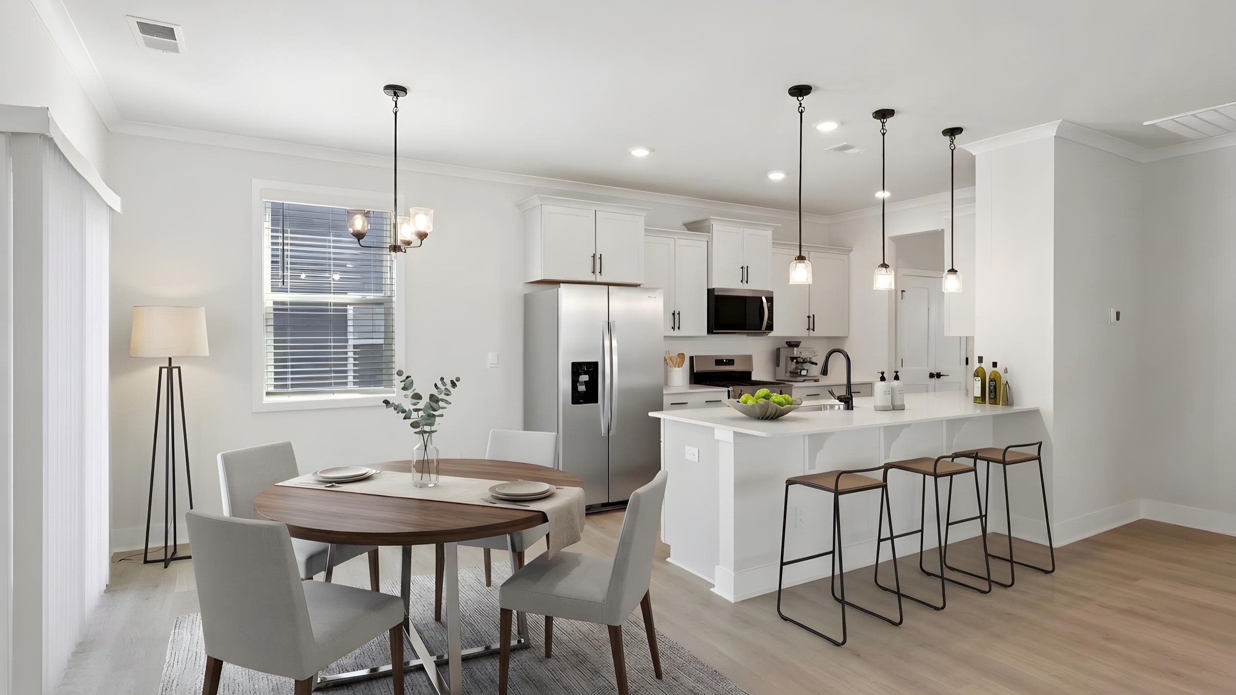 Kitchen and island with white cabinets