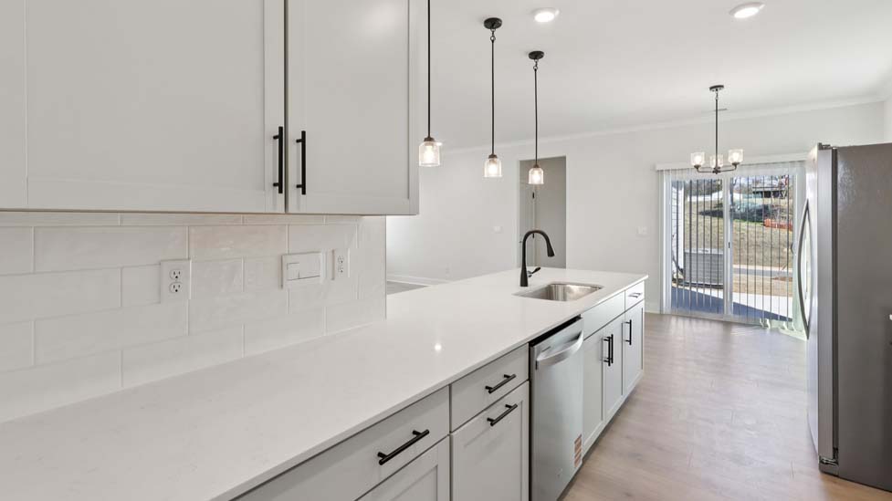 Kitchen and island with white cabinets