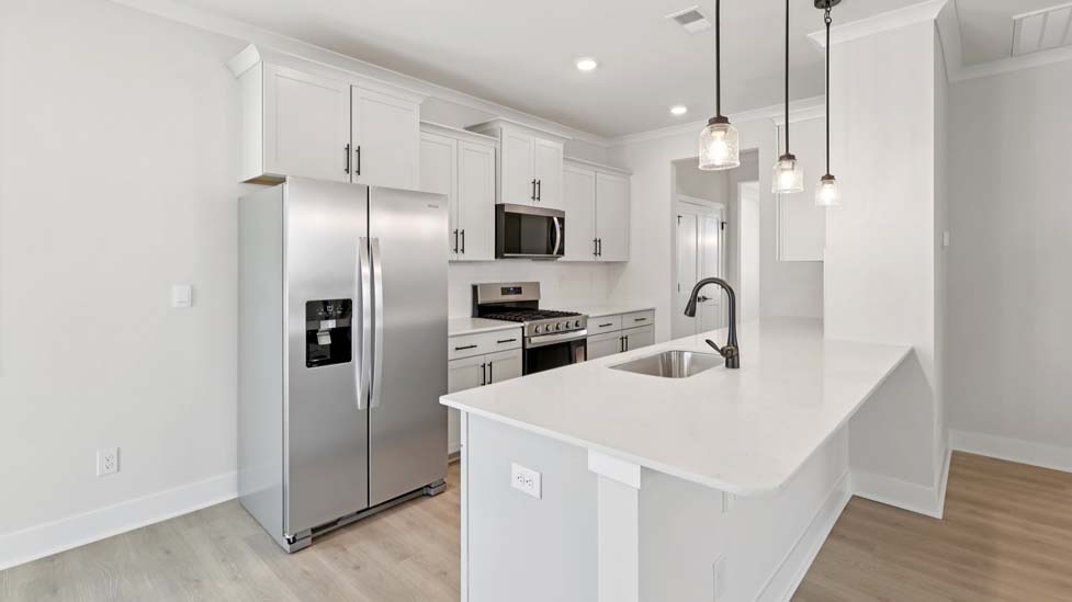 Kitchen and island with white cabinets