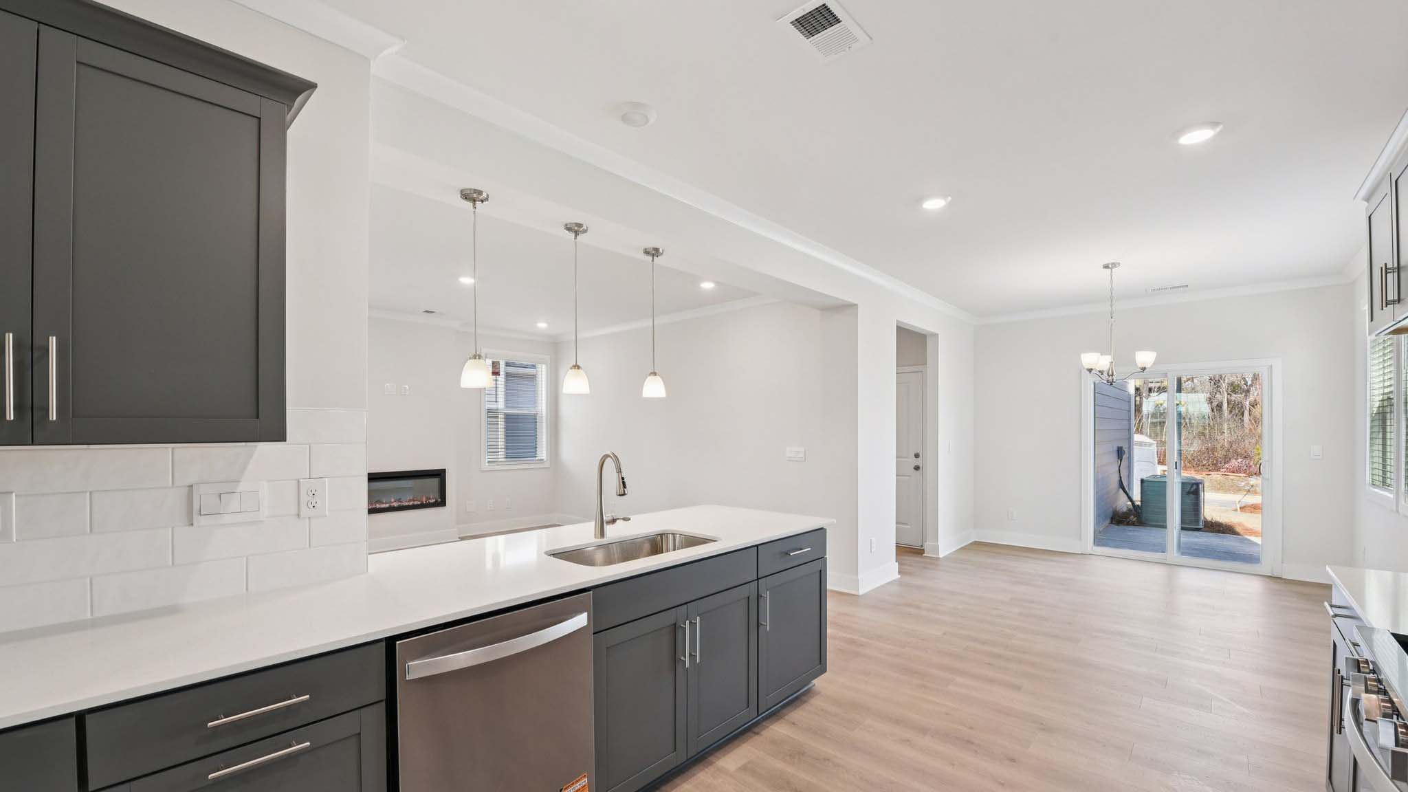 Kitchen and island with stainless steel appliances