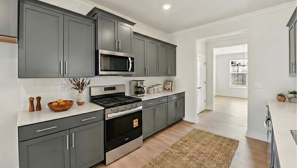 Kitchen and island with stainless steel appliances