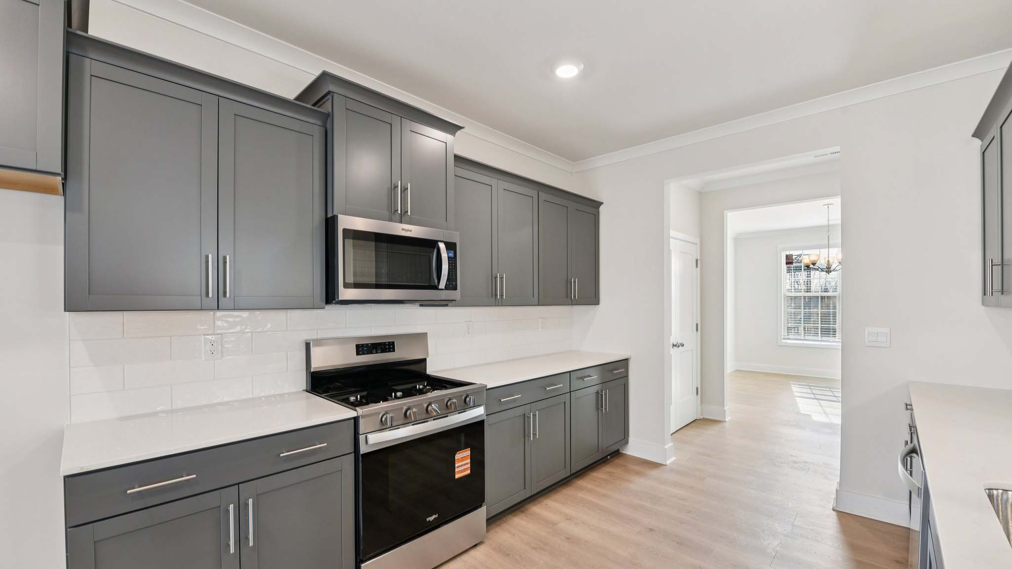 Kitchen and island with stainless steel appliances