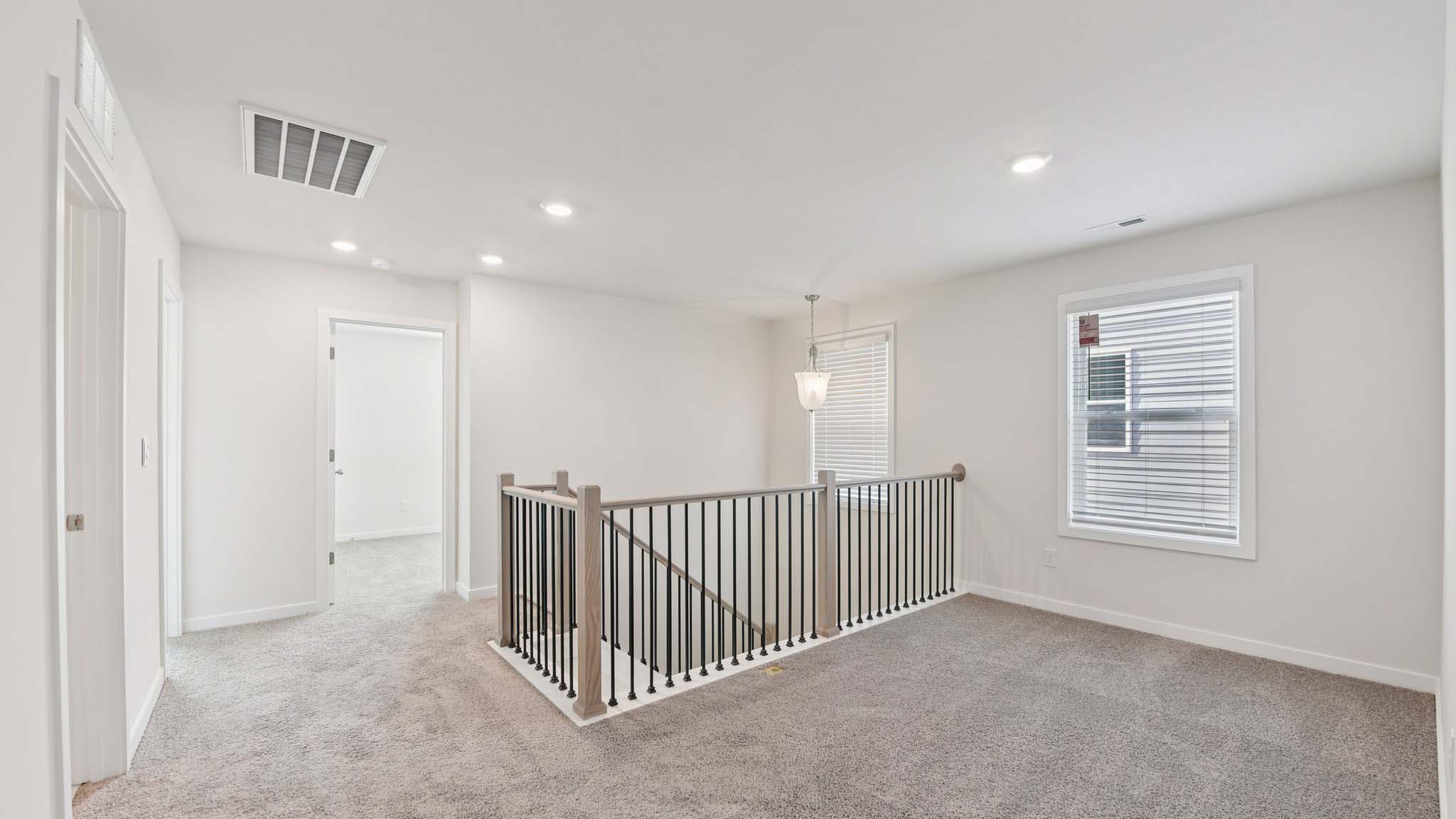 Carpeted bedroom with large window