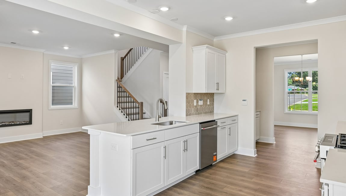 Kitchen and island with stainless steel appliances