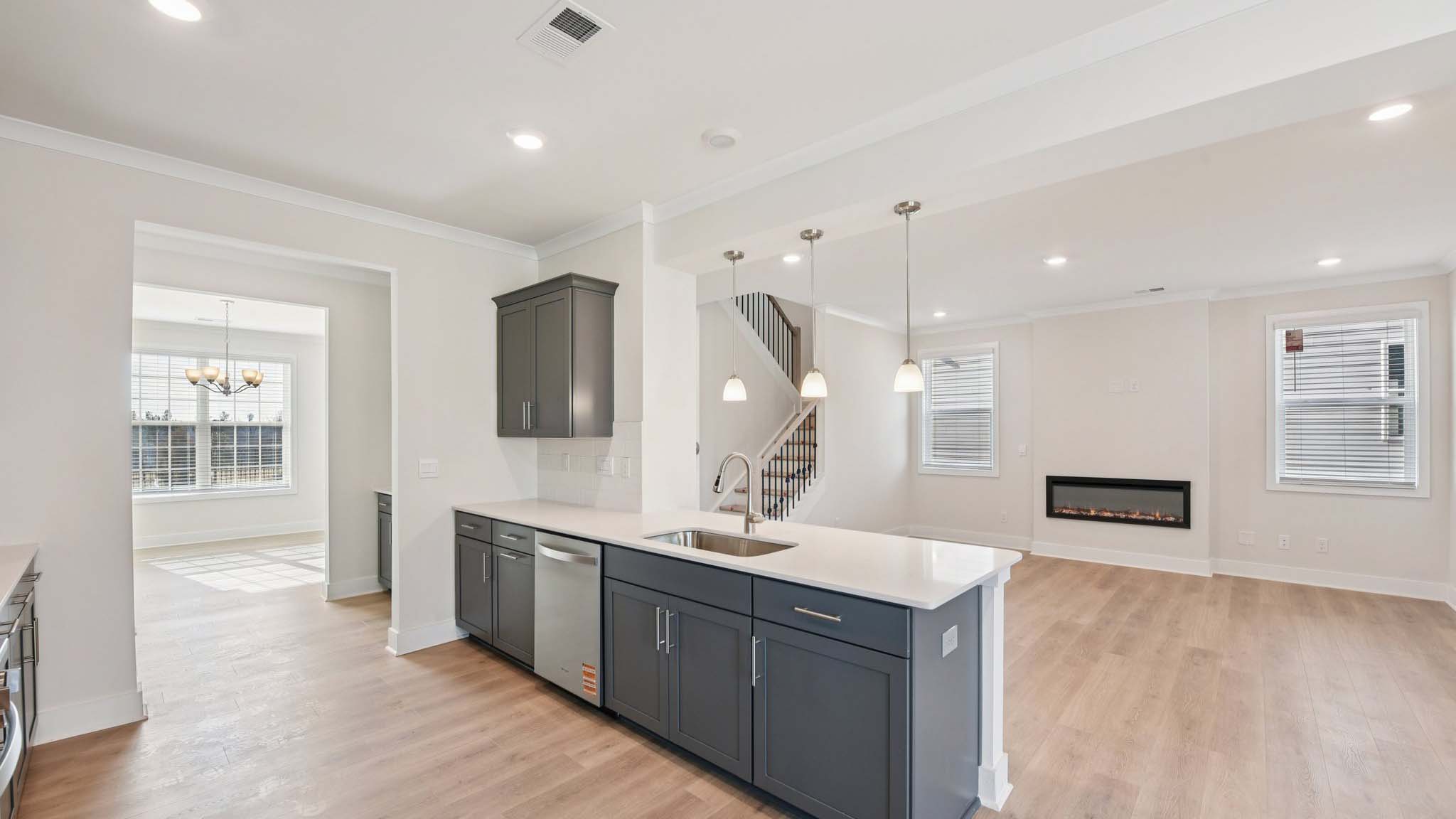 Kitchen and island with stainless steel appliances