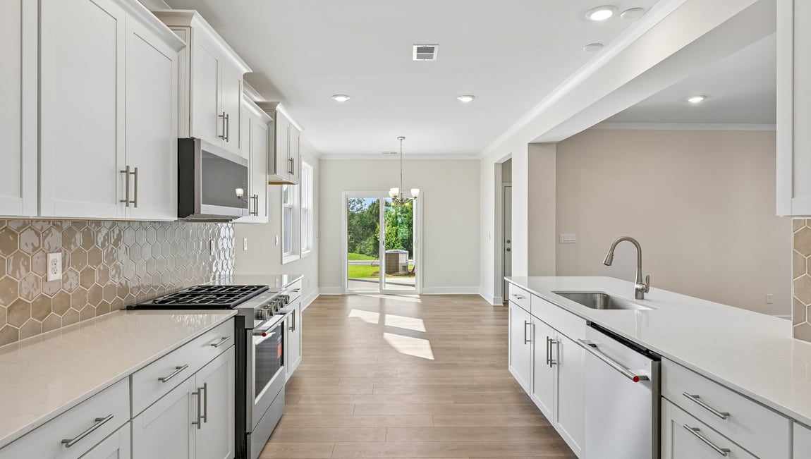 Kitchen and island with stainless steel appliances