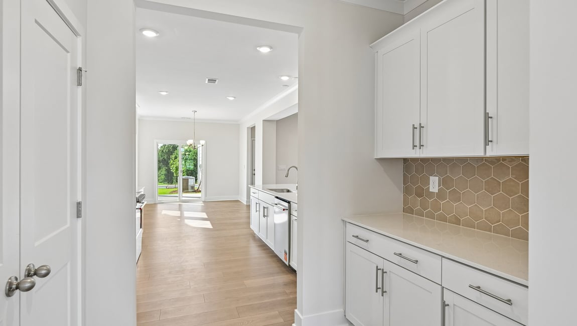 Kitchen and island with stainless steel appliances