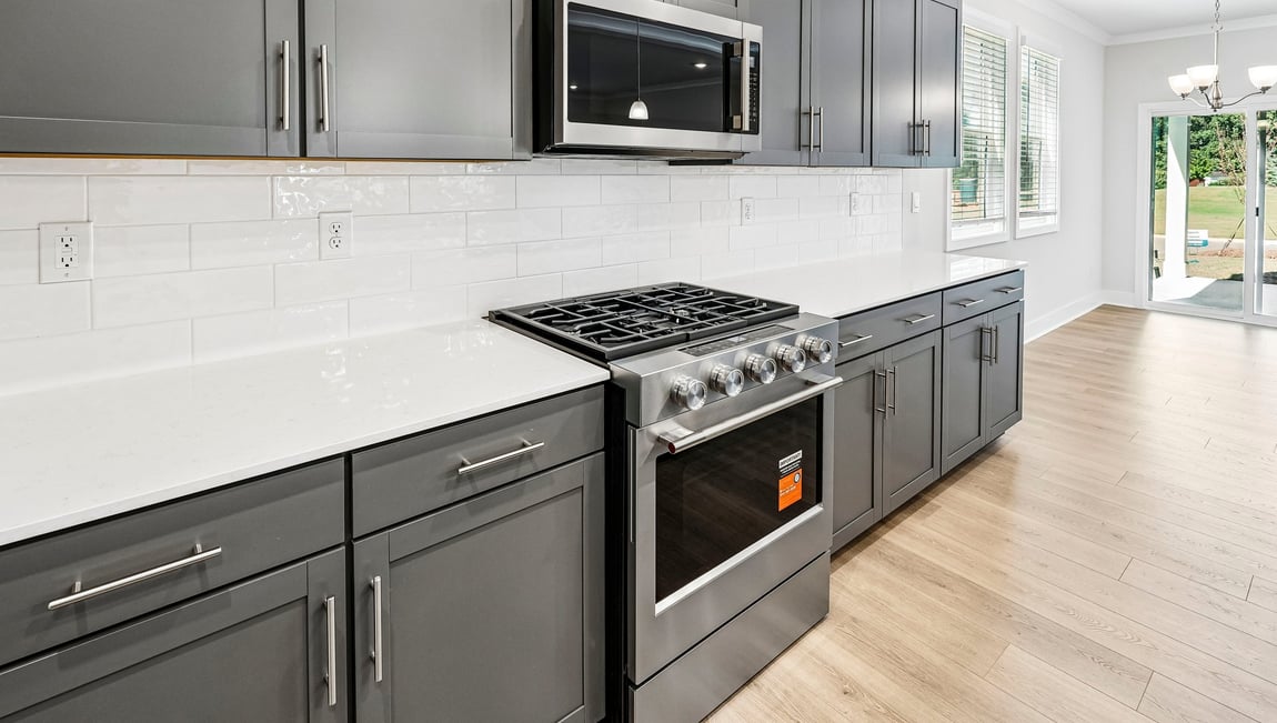 Kitchen and island with stainless steel appliances
