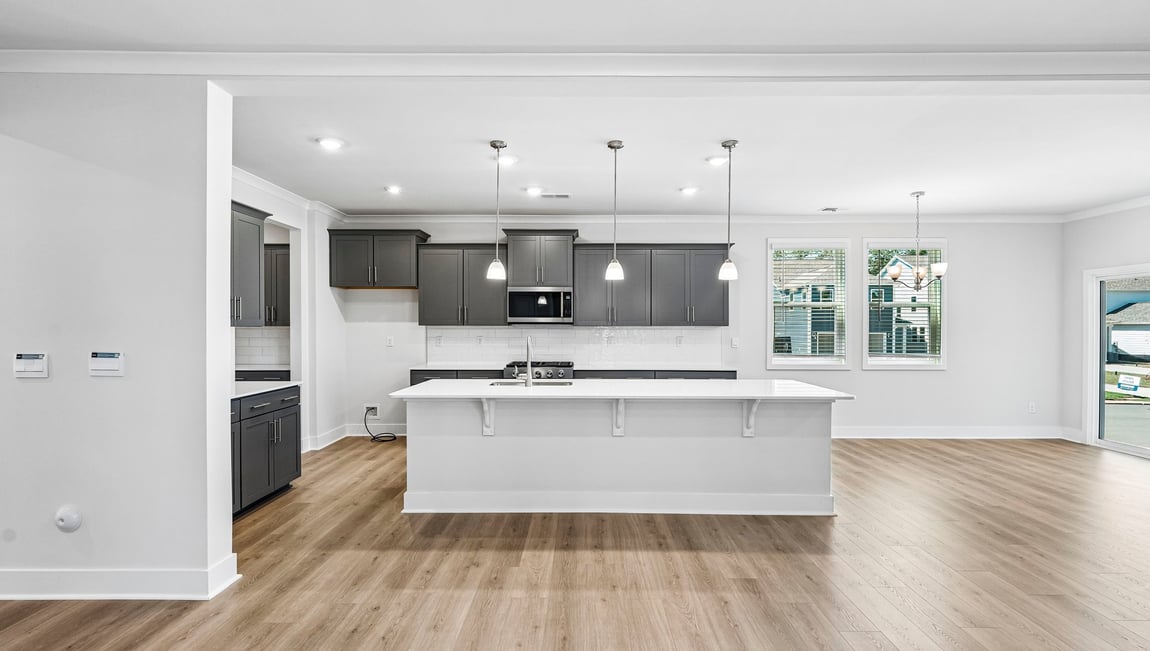 Kitchen and island with stainless steel appliances