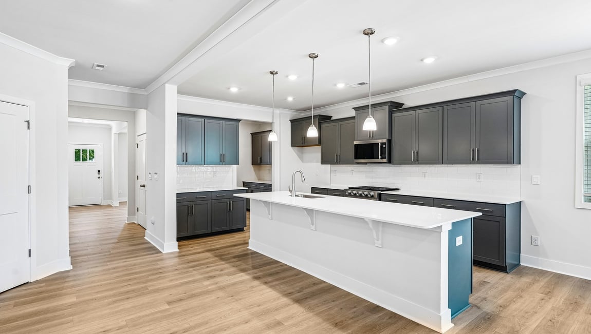 Kitchen and island with stainless steel appliances