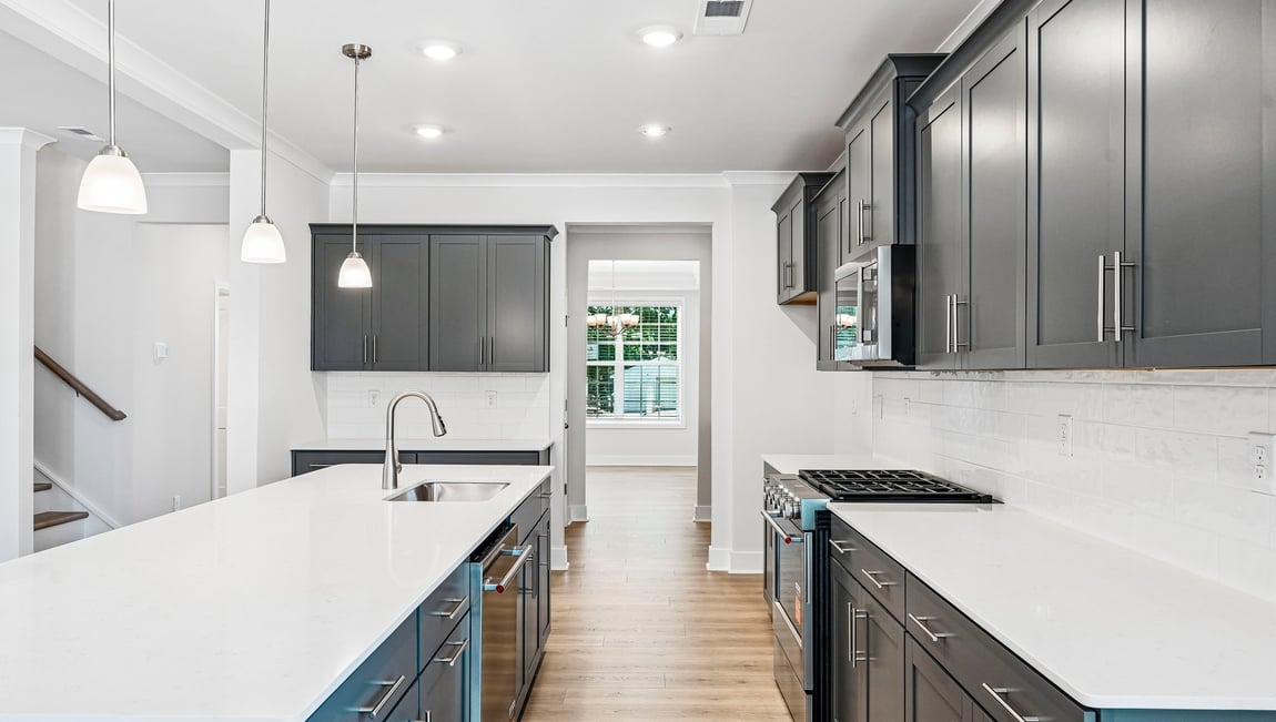 Kitchen and island with stainless steel appliances