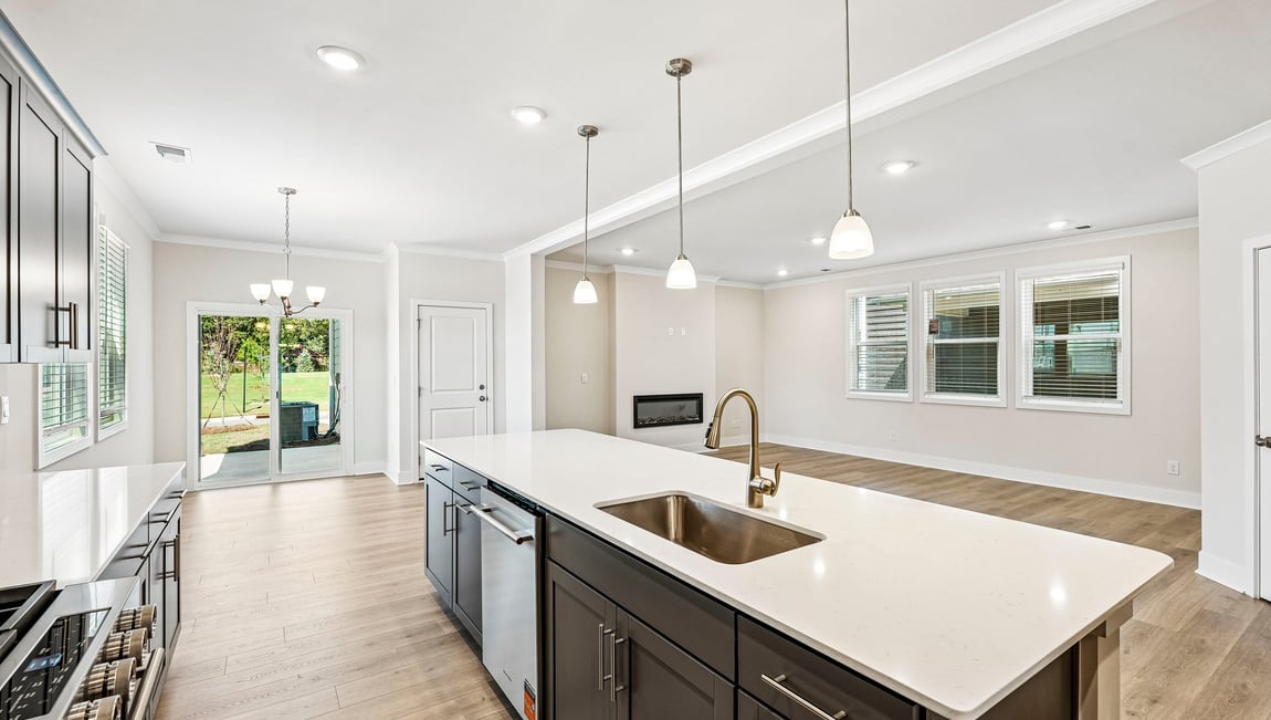 Kitchen and island with stainless steel appliances