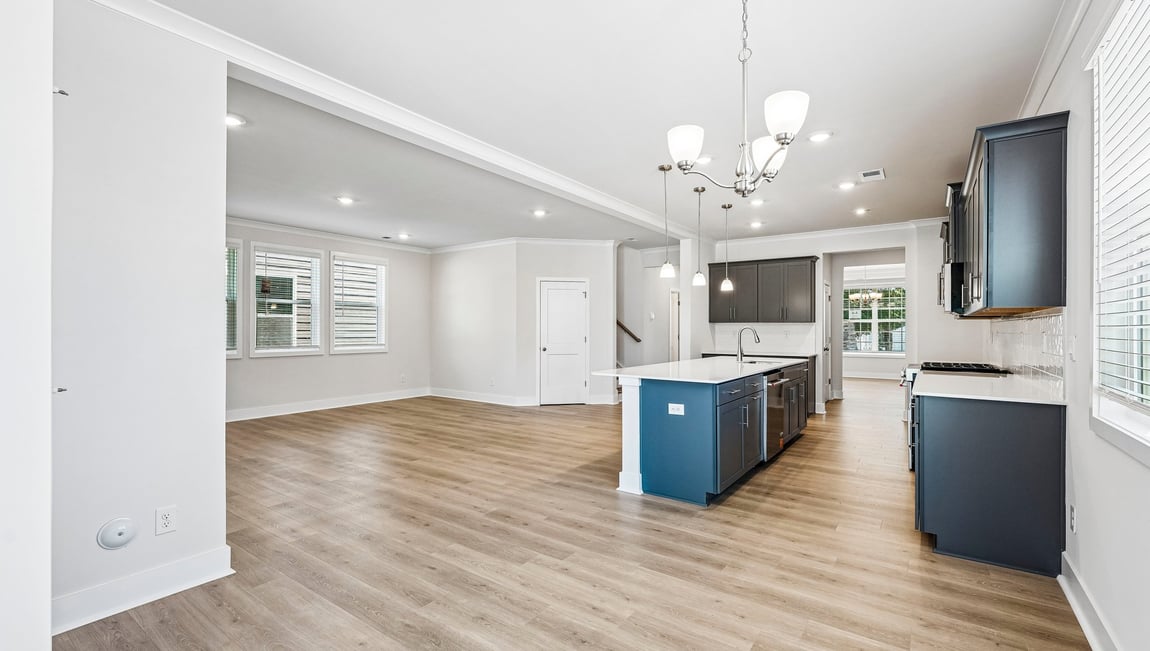 Kitchen and island with stainless steel appliances