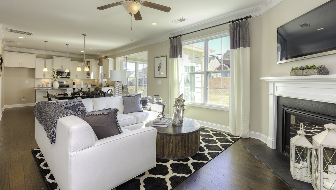 family room with large window and fireplace