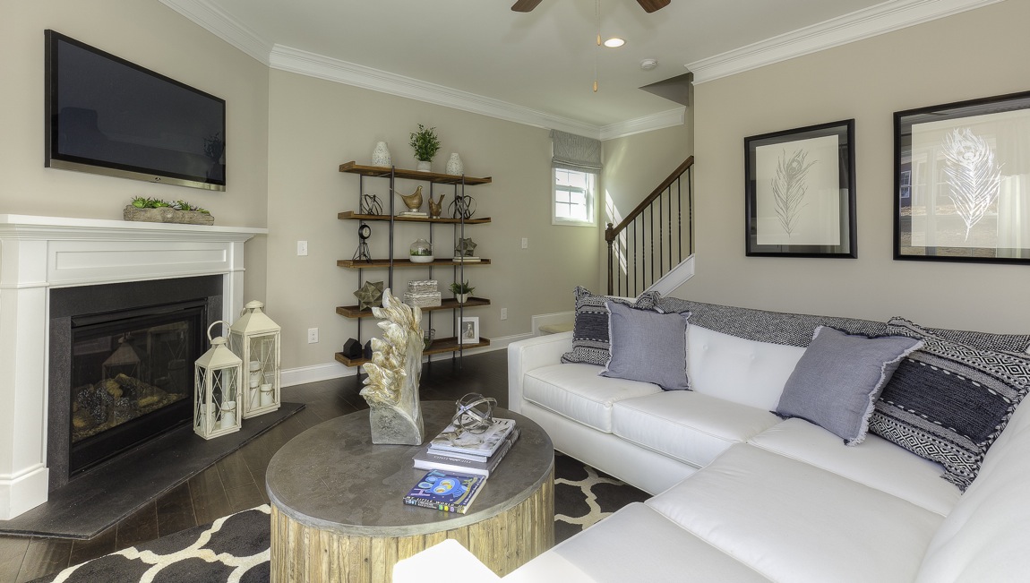 family room with large window and fireplace