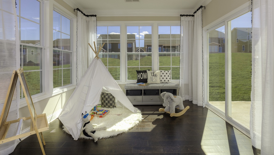 sunroom with large windows on each wall