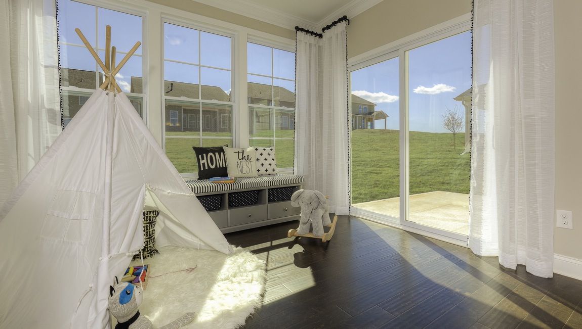 sunroom with large windows on each wall
