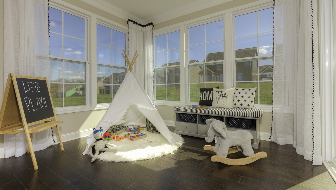 sunroom with large windows on each wall