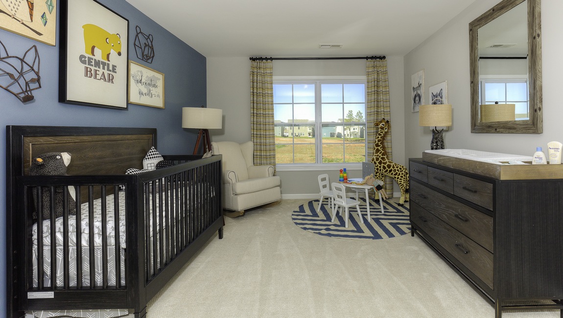 carpeted bedroom with large window