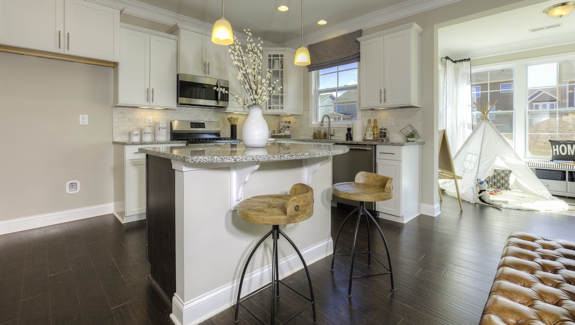 kitchen and island with stainless steel appliances