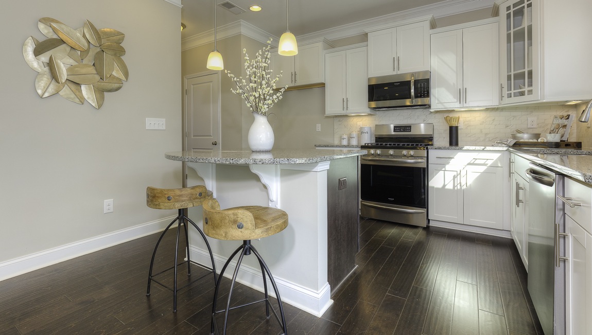kitchen and island with stainless steel appliances