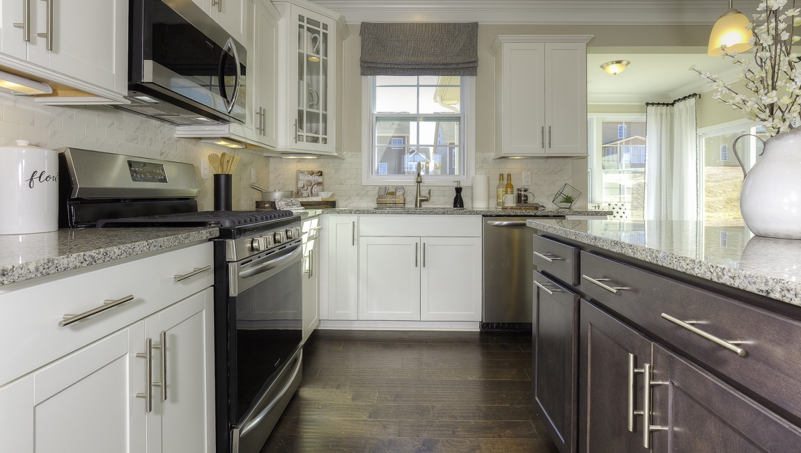kitchen and island with stainless steel appliances