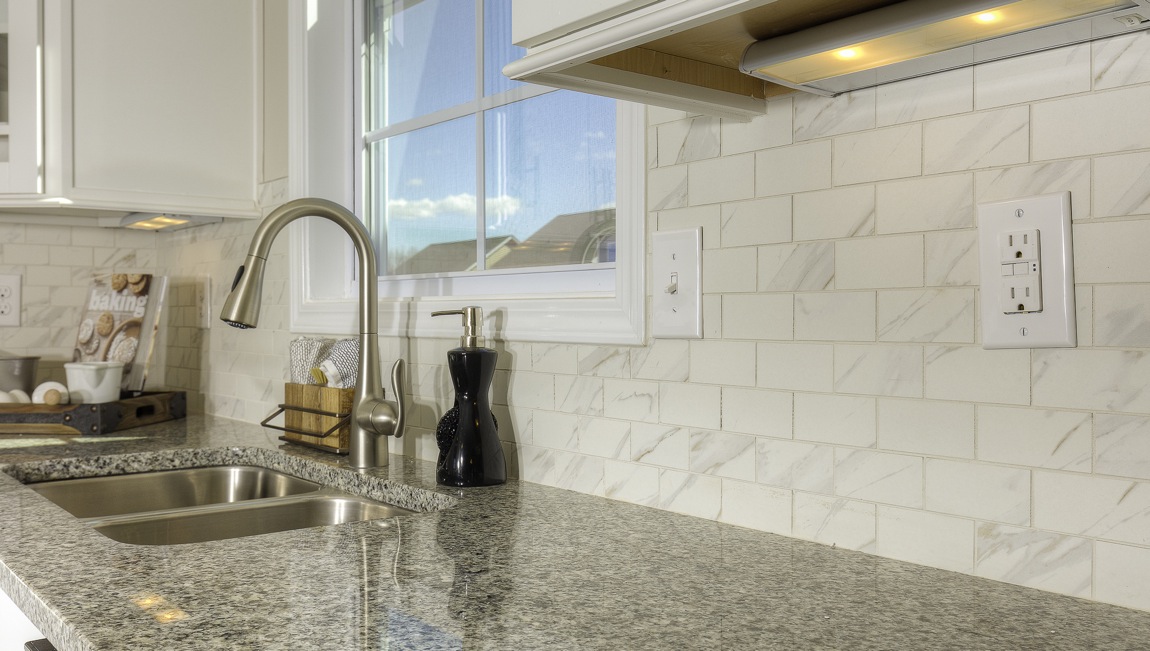 kitchen and island with stainless steel appliances